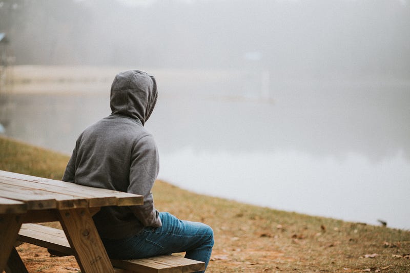 Individual reflecting in tranquility