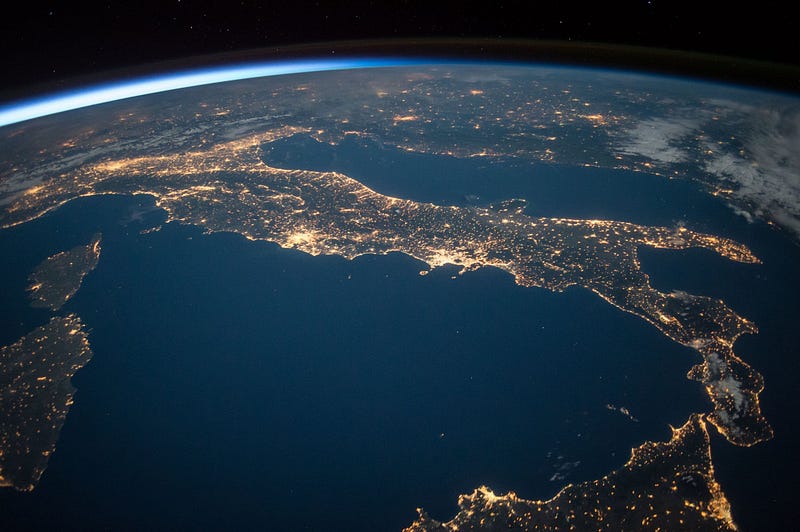 Nighttime city skyline illuminated by artificial lights