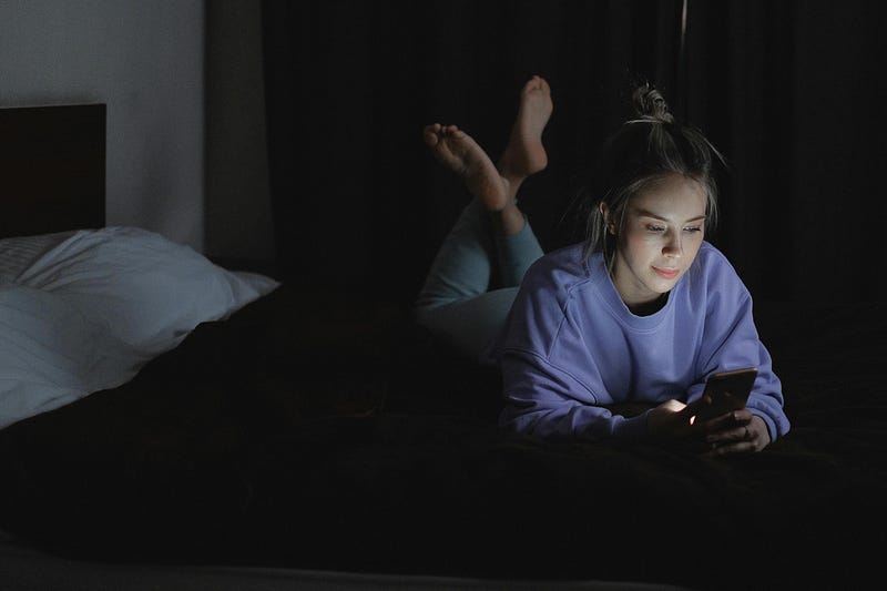 Person sleeping peacefully in a dark room