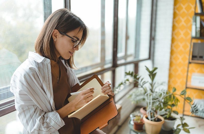 A person journaling as part of their daily ritual